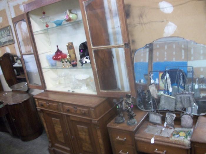 Nice walnut cabinet, opalescence glass, art glass, painted vase and rack of great mesh purses