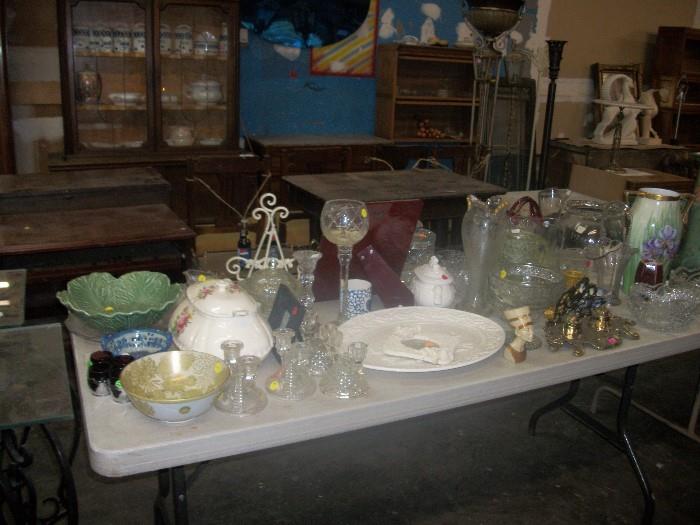 table full of glassware and misc.