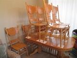 Golden oak table, 8 chairs, 2 leaves