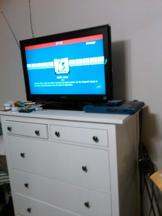 Sony TV and white dresser