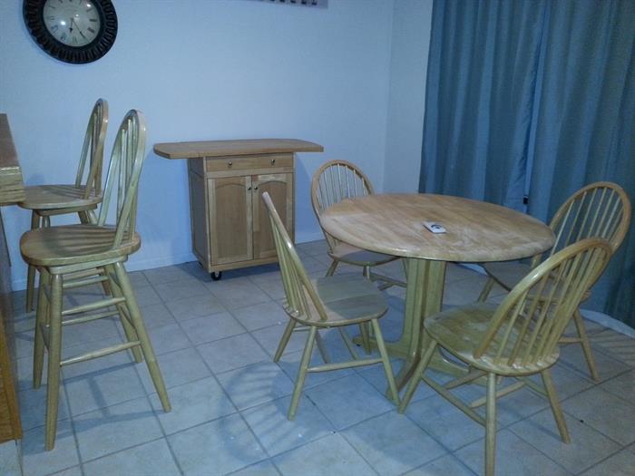 Set includes: Bar stools (2), Buffet Table, Table and Four Chairs. 