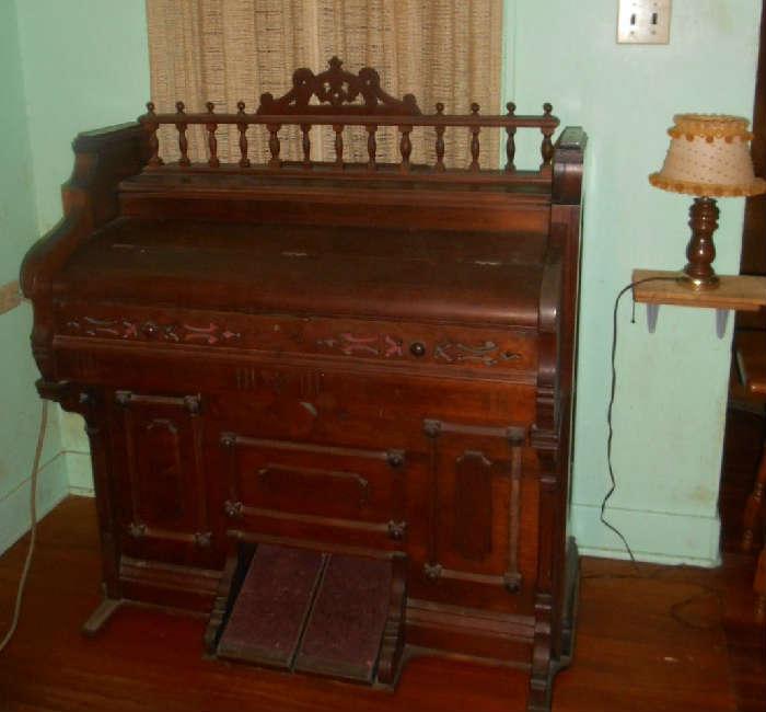 late 1800's Pump Organ..Needs TLC...Very nice wood..Could be made into great Desk....Very detailed..