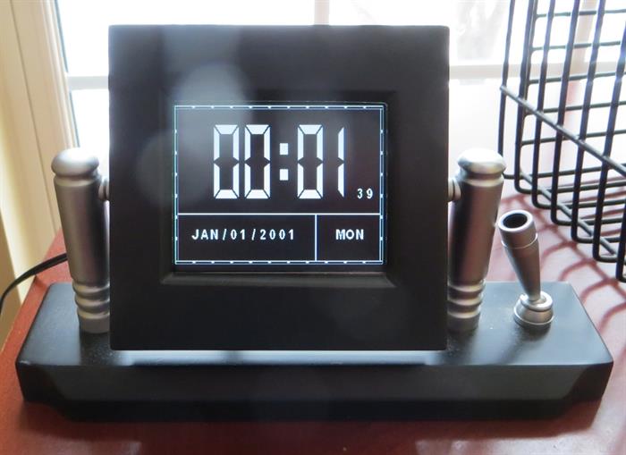 Brookstone digital clock/calendar/photo display