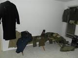 Korean war military uniforms, coats, cots, sleeping bag, boots and more.