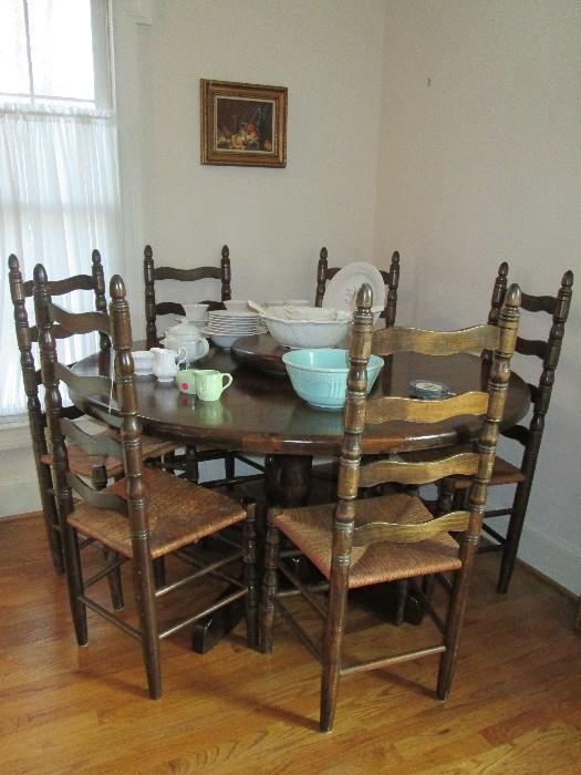 Vintage round pine pedestal dining table with lazy susan & 6 ladder back chairs with rush seats