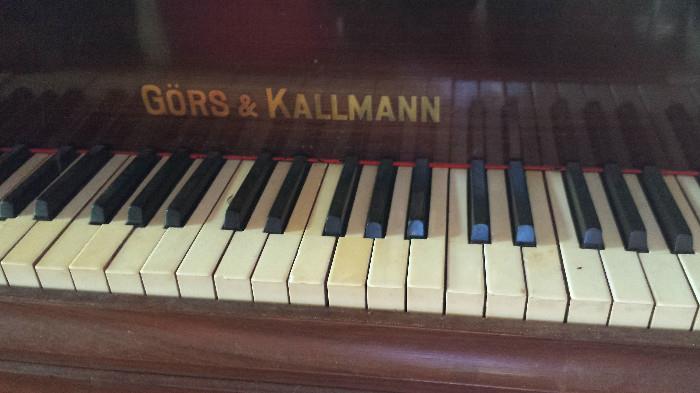 The Gors and Kallmann baby grand piano needs a lot of TLC to put it in playing condition but has loads of good looks.