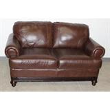 Nice brown leather loveseat in overall good condition