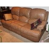 Recling Sofa, tan color leather sofa that reclines on both ends