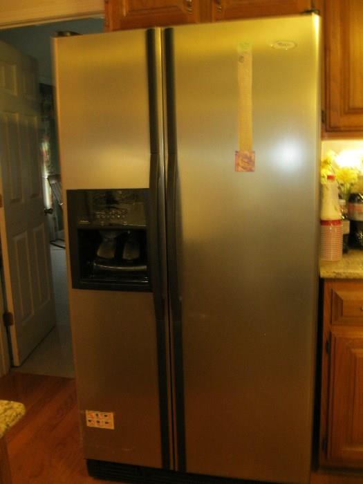 Whilpool  side by side refrigerator 25.4 cu ft - height 69.75"   width 35.5"      depth  33.75"
