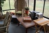 Wicker chair, much in the way of  misc. tables, stereos, etc...