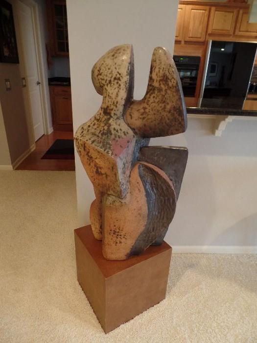 Robert Pulley, Large beige and brown ceramic sculpture on large pedestal called, "Foot in Mouth"