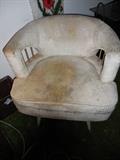Mid Century. Swivel Arm Chair.Frame is good shape.Needs re upholstering Or deep cleaning.