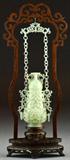 8. CHINESE QING CARVED CELEDON JADE REVOLVING VASE IN FITTED STAND.