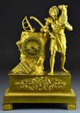 11. FRENCH EMPIRE GILT BRONZE FIGURAL MANTLE CLOCK.