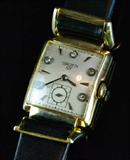 49. GRUEN 14KT GOLD AND DIAMOND ANTIQUE WATCH.