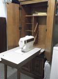 Singer Touch-Tronic 2001 sewing machine in pecan cabinet