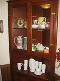 Antique corner cabinet with assorted glassware