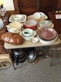 Pyrex bowl along with assortment of pots and pans