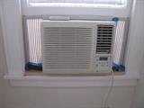 Late model window air conditioner. Not too large. Good for smaller spaces.