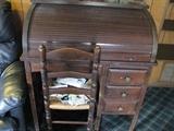 Closer view of rollup wooden antique desk.