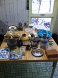 Various pottery pieces, bowls, and plates.