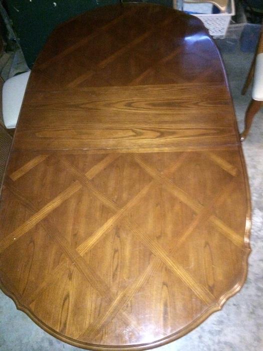 parquetry top dining table with two captain's chairs, 6 chairs total