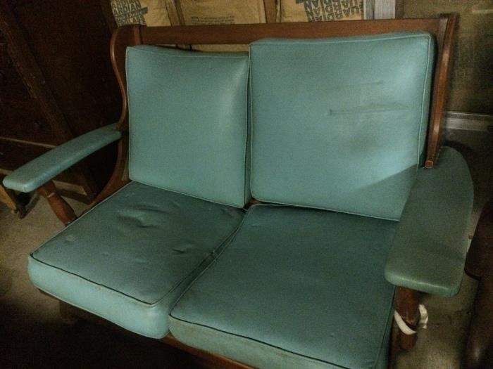 this early american settee took a lot of little naugees to recover it!!!   Turquoise naugahyde!!!