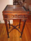 ornately carved kettle stand or table
