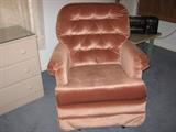 soft pink upholstered rocker arm chair