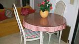 Table has leaves and four chairs