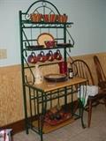 Nice iron bakers rack loaded with kitchenware