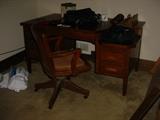 Large wooden desk with bankers chair