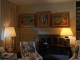Slip covered arm chairs, Mahogany console, great lamps, signed and numbered art