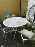Huge assortment of wrought iron chairs, tables and side table