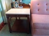 Drexel mahogany lamp table with marble top, and pull out shelf.