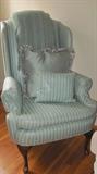 One of a pair of nicely upholstered wing chairs. 