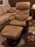 Swiveling leather recliner and foot stool