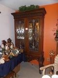  Ornate wooden china cabinet with decorative glass doors: height 7ft., width 49", depth 16.5"