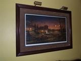 There are several very nice prints in the home.  This one is large and has a light with it - this one is Terry Redlin signed 1999.