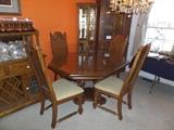 Wooden table and 4 chairs with glass top and leaf: 58" long and 45.5" wide