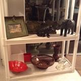 Metal frames & planters, cast iron pig bank (repro), cast metal elephant, colorful pottery, vintage Japanese basket, carved wood vase