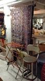 Funky Oriental rug (rather worn), child-size drying rack, vintage metal stool