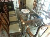 large glass top dining table with antique carved base and 8 antique queen anne chairs