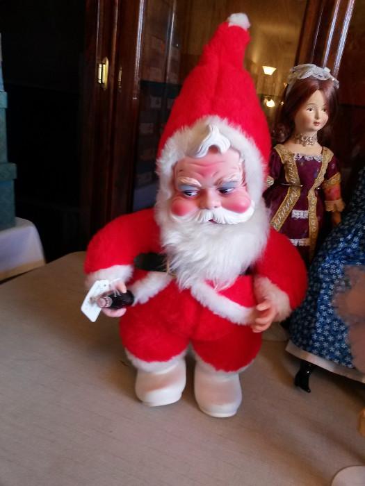 vintage Santa holding Coca Cola bottle