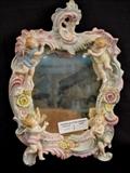 5  - Dresden porcelain mirror with 4 cupids, 14 in. T, 9 in. W.
