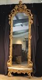 22 - Palatial Gold Victorian pier mirror with marble base, framed with ornate grape leaves and cherubs, ca. 1850. 11.7 in. T, 53 in. W.