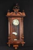 37  - Victorian walnut wall clock with carved horse crown, 41 in. T, 16 in. W, 8 in. D.