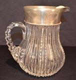 47  - Large heavy cut glass pitcher with sterling rim, 9.5 in. T, 8 in. T