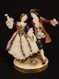 62  - Royal Doulton figurines of lady and man dancing, 8 in. T, 6 in. W.
