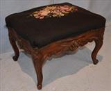68  - Walnut Victorian needlepoint footstool, ca. 1880, 15 in. T, 20 in. W, 16 in. D.